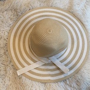 Tan and white floppy sun hat